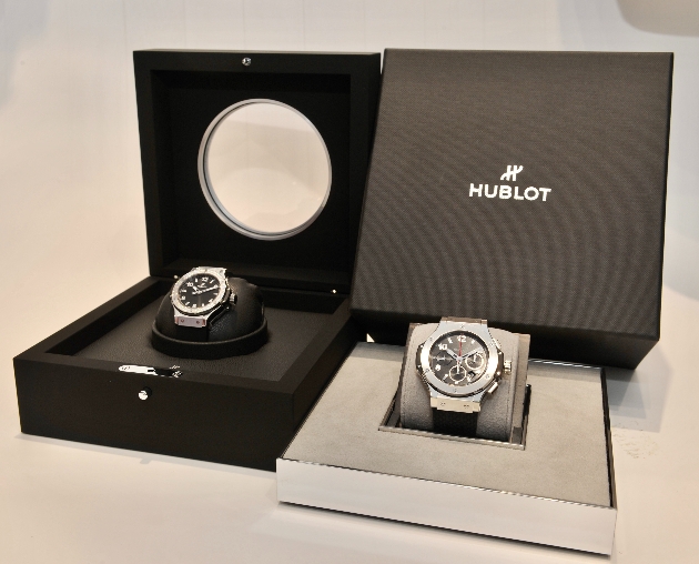 two silver watches in gift boxes