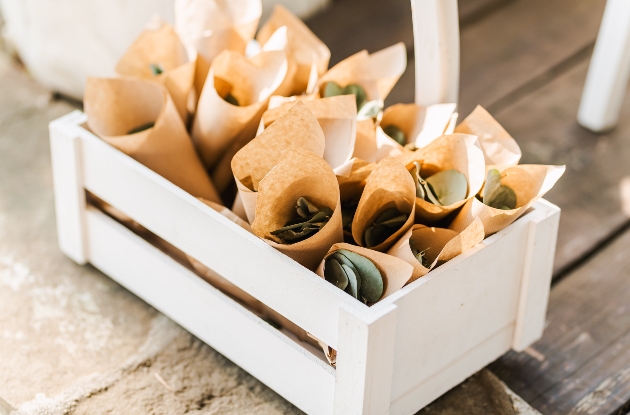 leaves in a paper cones in a white crate