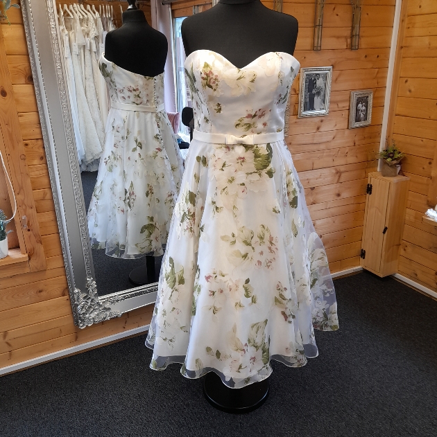floral 50s wedding dress on a mannequin