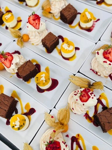 Coloured desserts on white plates