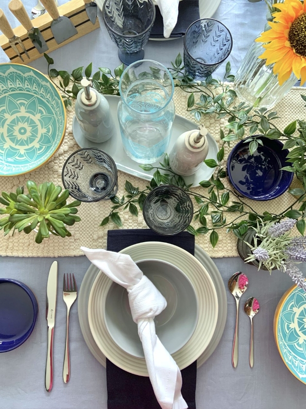 table set up of natural coloured crockery with blue accents