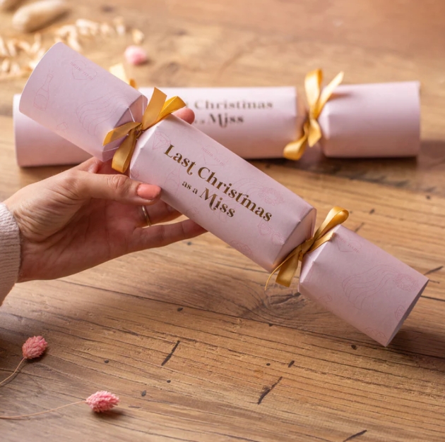 pink xmas crackers with gold bows last xmas as a miss