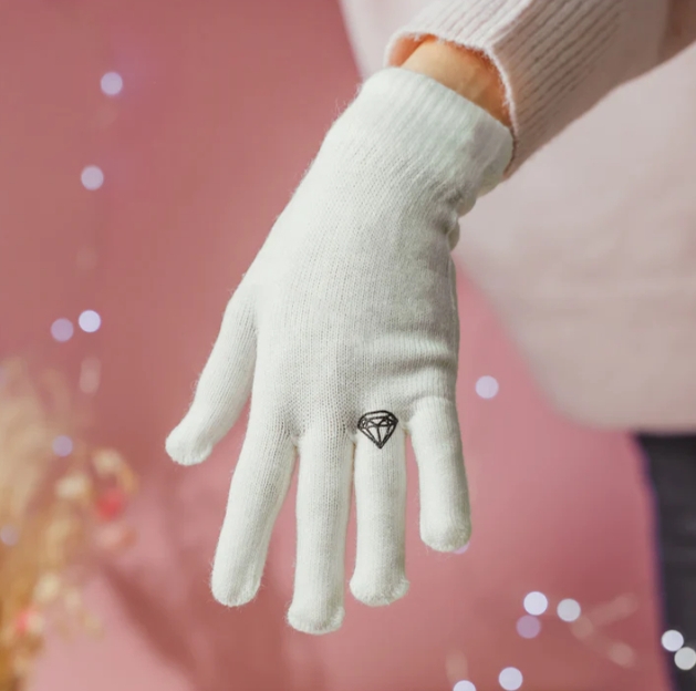 white glove with black diamond on ring finger