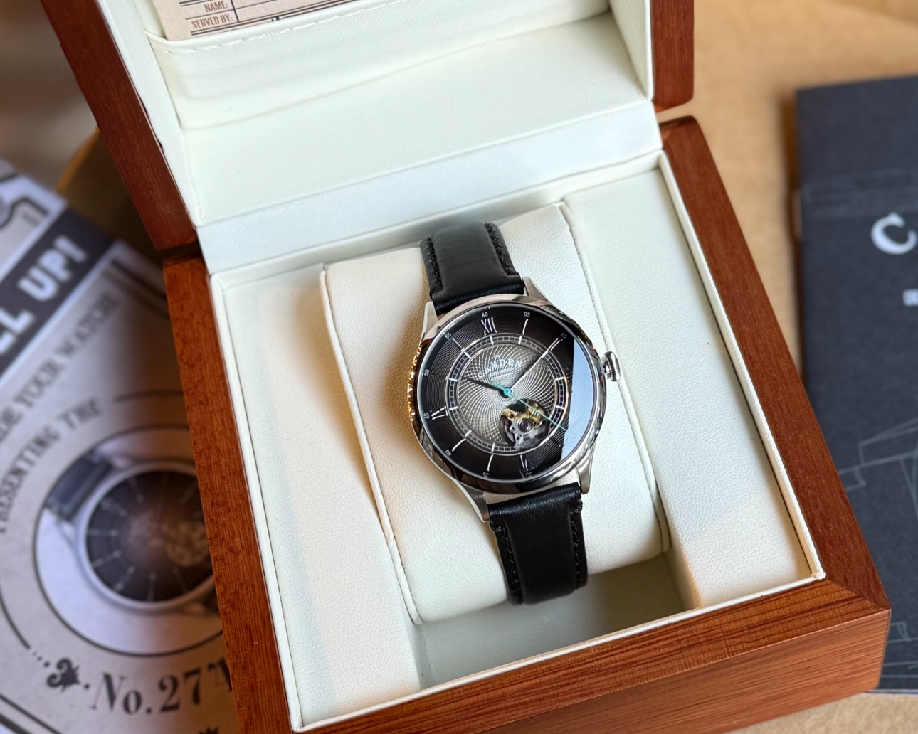 black and silver watch in luxe wooden box