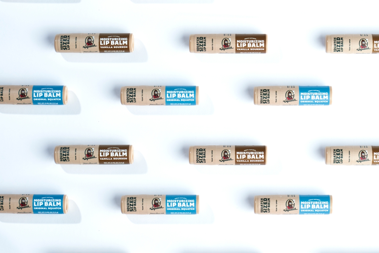 blue and brown lip balms on white background