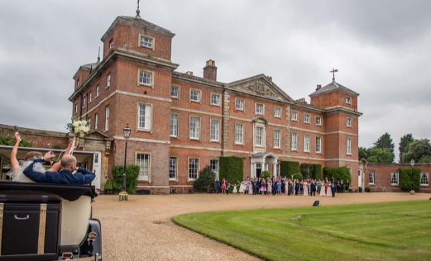couple driving up to kimberley hall