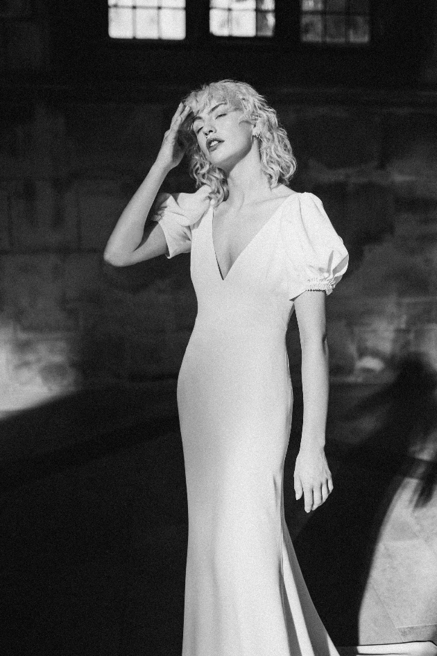 A wedding dress by the brand Rolling In Roses