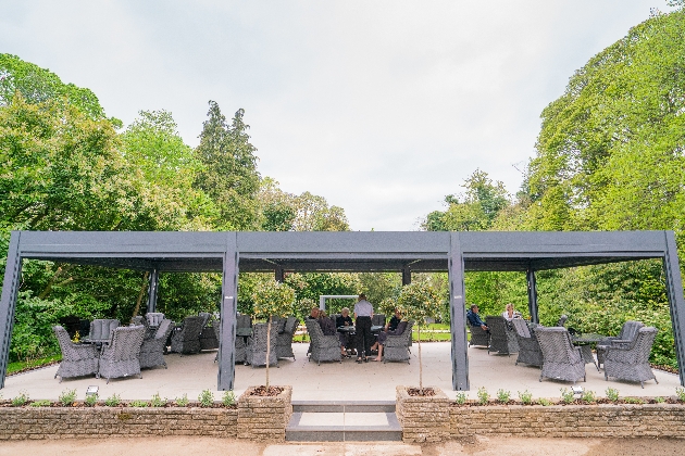 An outdoor seating area surrounded by trees