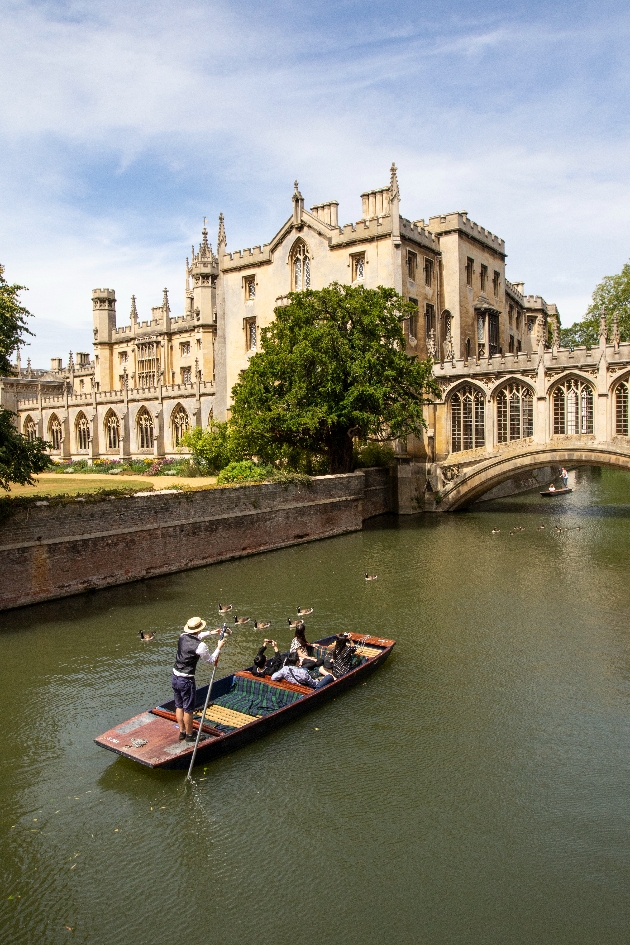 A boat punting in front of a cathedral