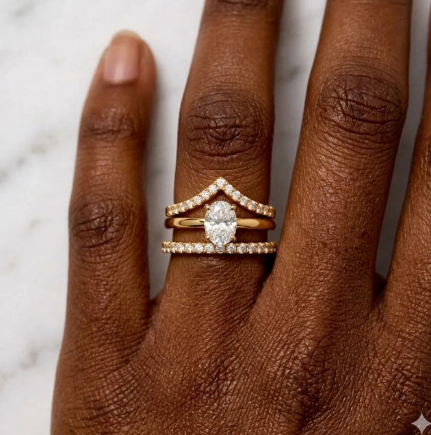 A thin solitaire, a wishbone ring and an eternity band on the outside