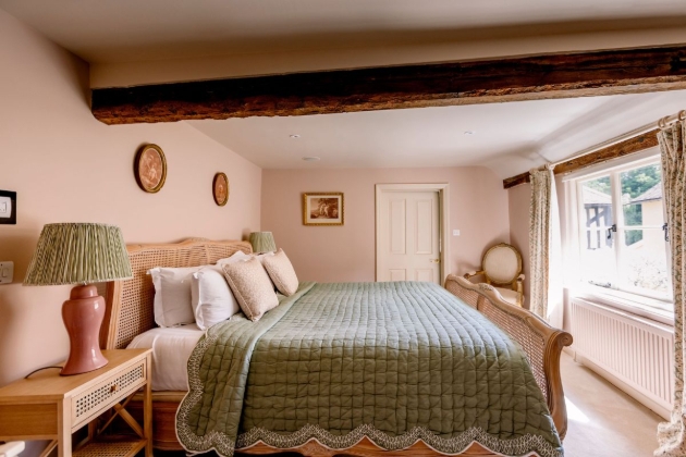 country pub bedroom, with a pink and green colour palette interior
